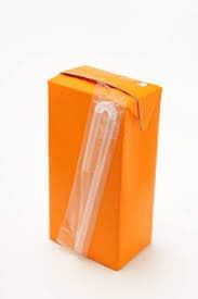 An orange juice box with a straw attached.