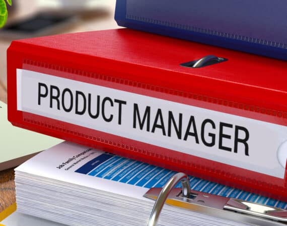 A red binder with the label "product manager" on the spine.