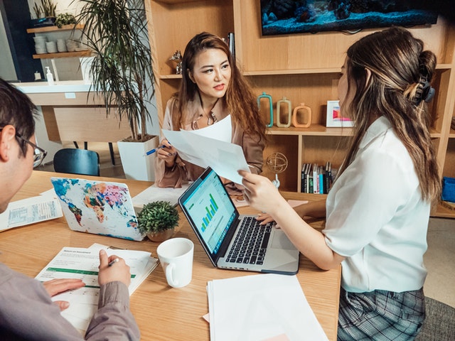 two woman working in office together