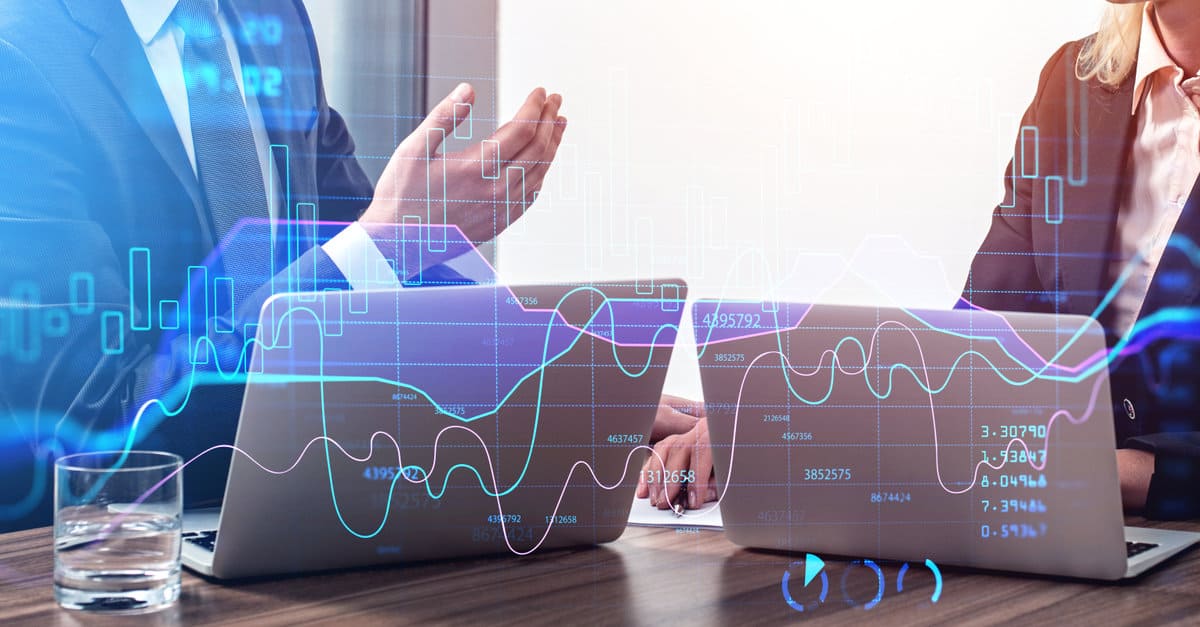 Two businesspeople traders working together to develop new trading strategy. Stock market changes. Concept of internet trading and teamwork