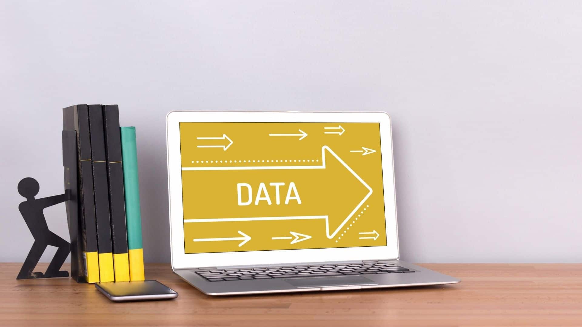Book end with a stick figure person pushing books forward. Laptop with an arrow pointing right with data inside the arrow.