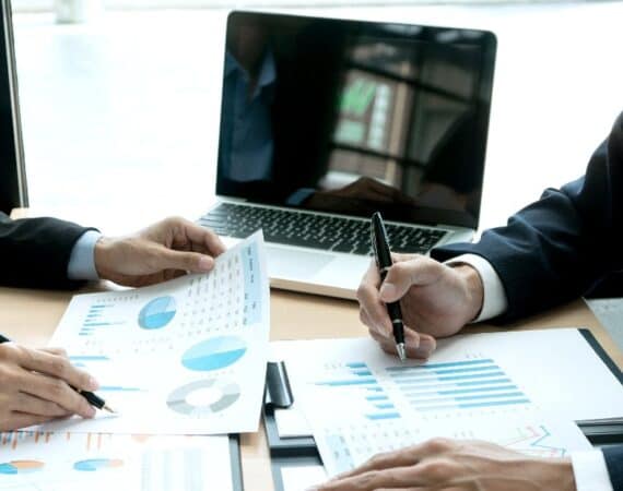two people evaluating reports