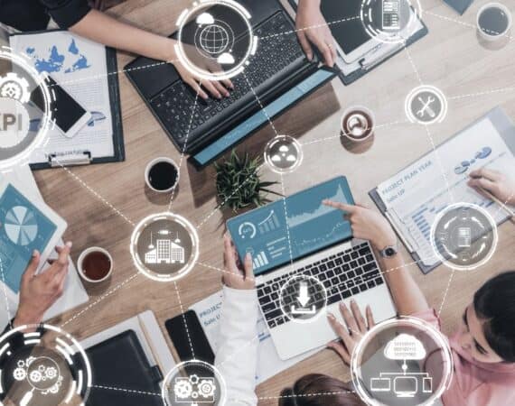professionals evaluating reports on computer
