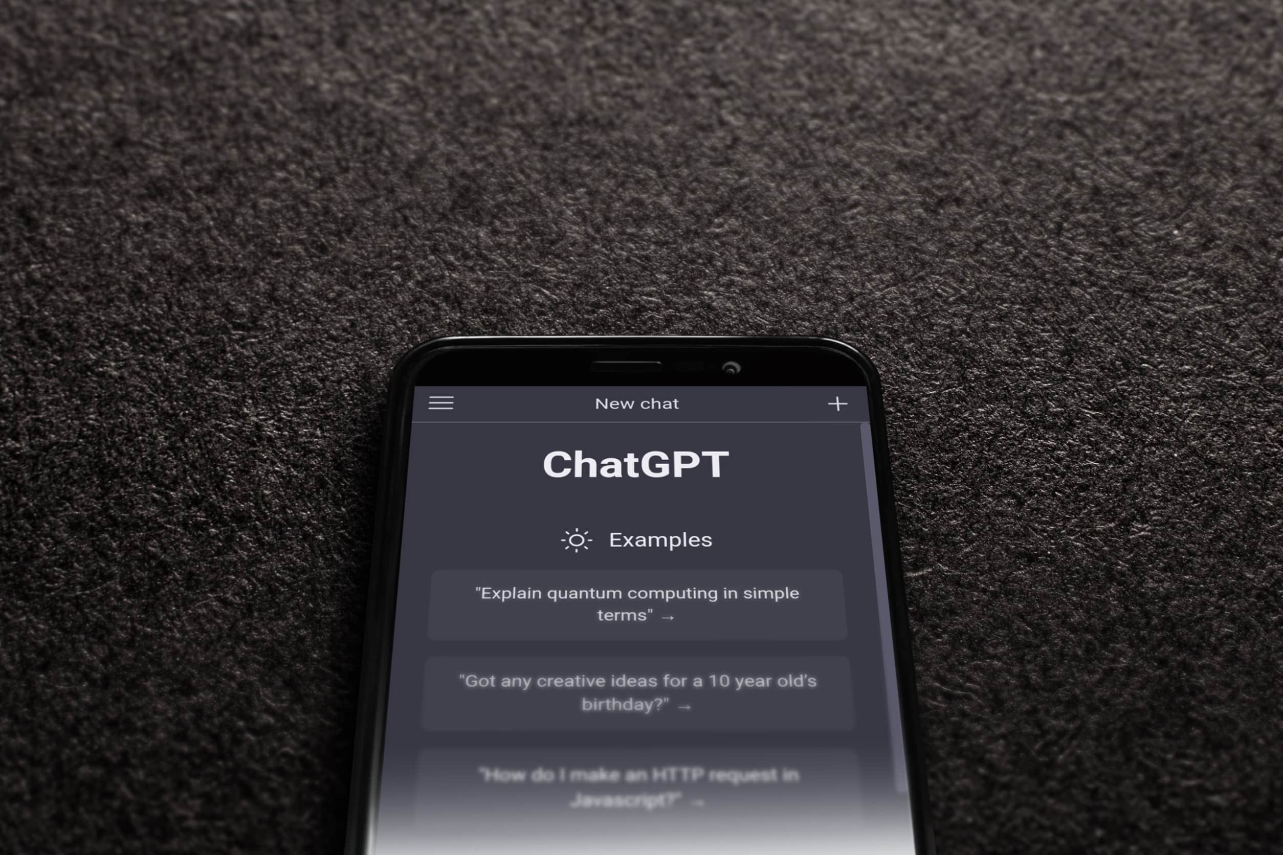 A smartphone displaying ChatGPT AI against a black background.