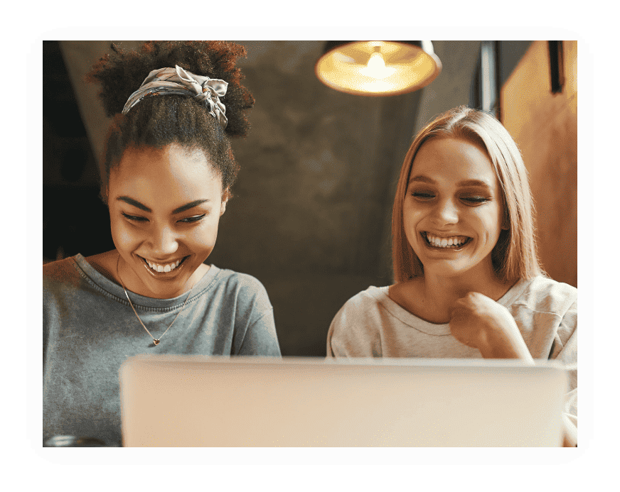 Two women looking at the computer screen